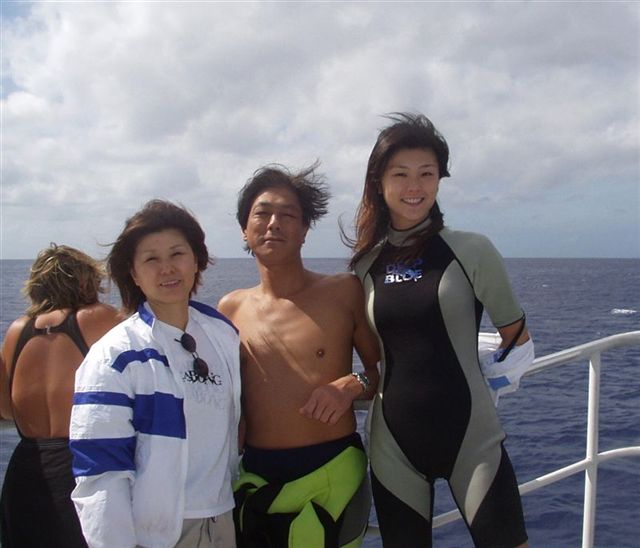 A family of divers heading out to sea